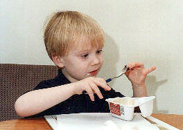 Oliver enjoying a yoghurt